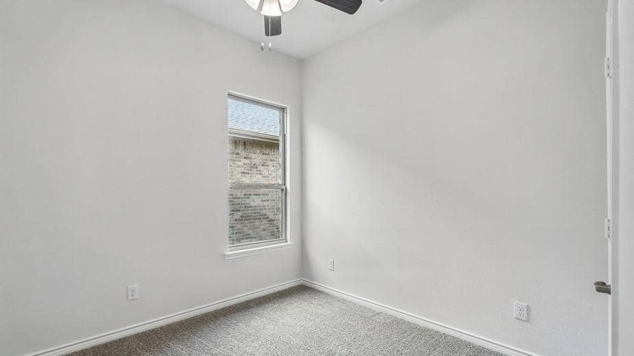 2510 Wesley Avenue, Royse City, TX 75189 Neutral-toned room with a single window, light gray carpeting, and white baseboards
