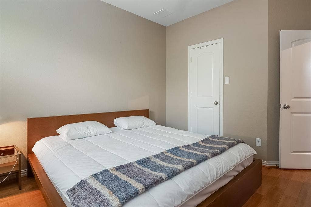 2248 Fletcher Trail, Plano, TX 75025 Warm neutral-toned walls complement wood-finish flooring