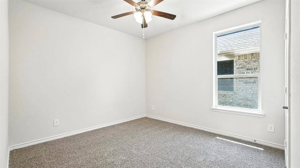 2503 Wesley Avenue, Royse City, TX 75189 Room featuring neutral carpet flooring, light-toned walls, and a ceiling fan with light fixture