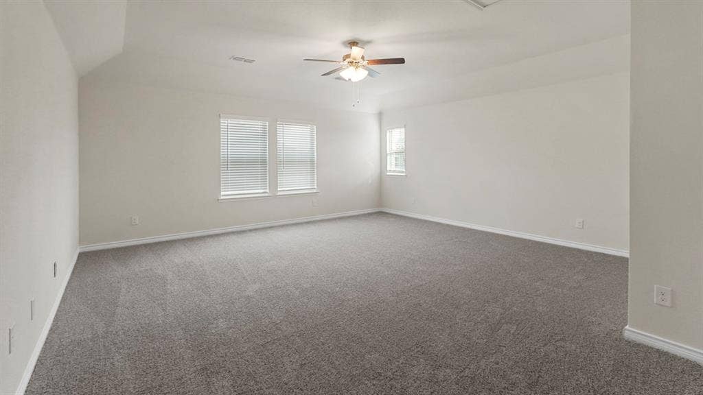 750 Hart Leaf Lane, Lavon, TX 75166 Spacious room featuring gray carpet, light-toned walls, and a ceiling fan with integrated lighting