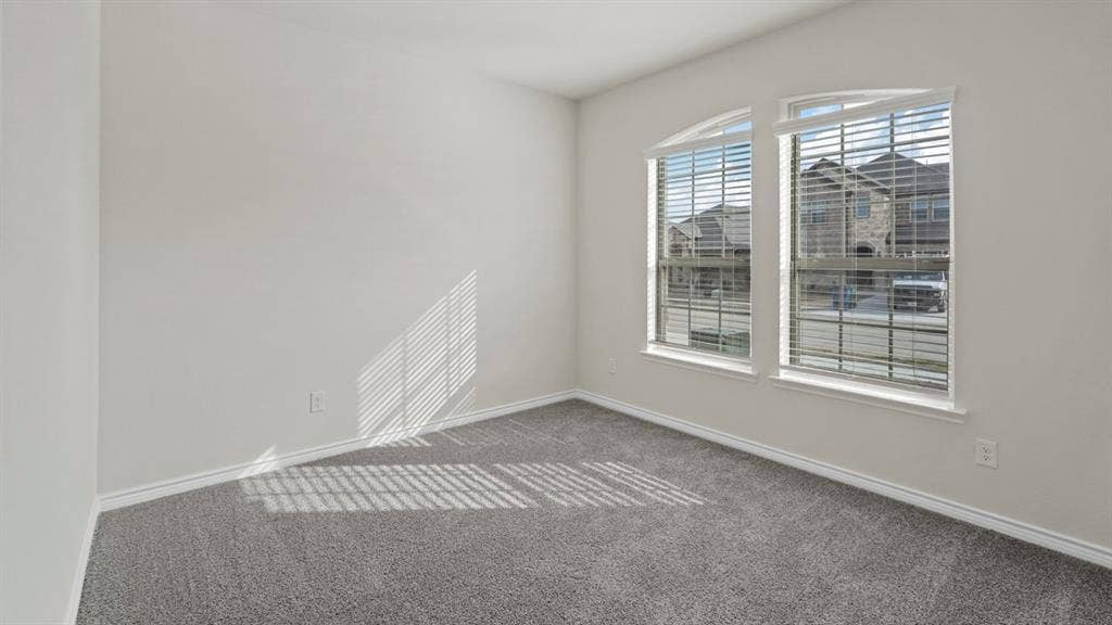 750 Hart Leaf Lane, Lavon, TX 75166 Room featuring light gray walls, gray carpeting, and white baseboards