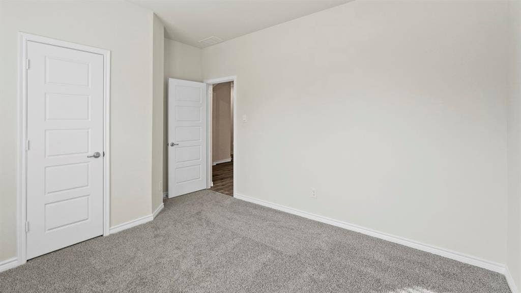 750 Hart Leaf Lane, Lavon, TX 75166 Neutral-toned interior with light gray walls and plush gray carpeting