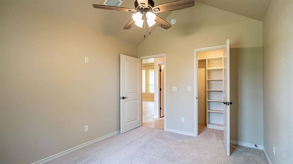 2714 Austin Drive, Granbury, TX 76048 Secondary bedroom with walk in closet