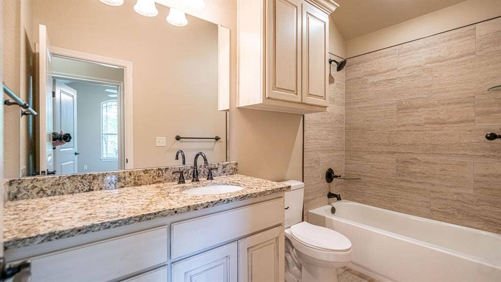2714 Austin Drive, Granbury, TX 76048 Secondary bathroom with shower tub combo