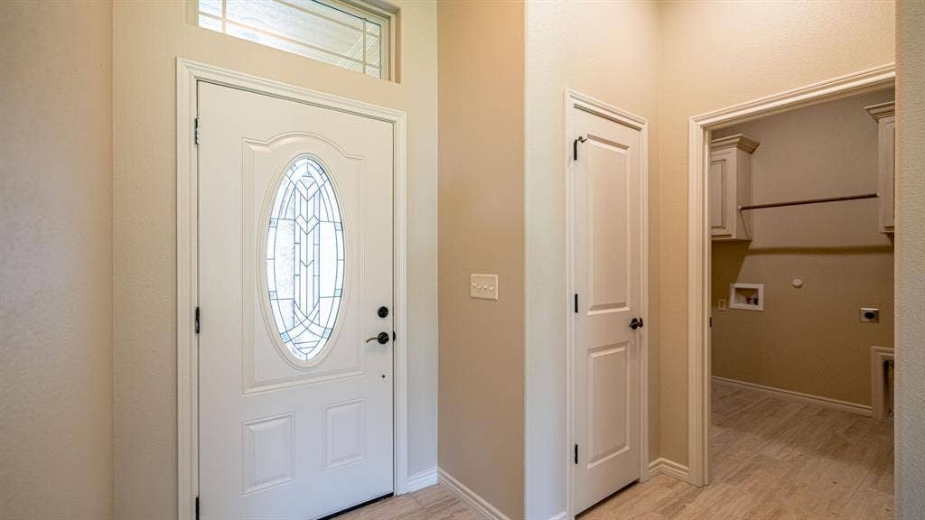 2714 Austin Drive, Granbury, TX 76048 Front entrance with coat closet and access to laundry room