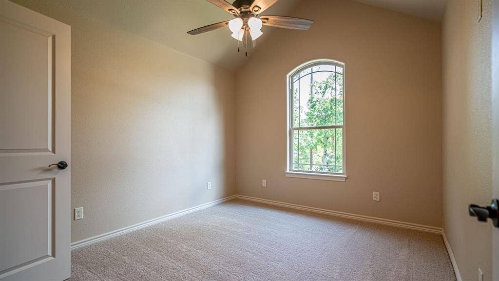 2714 Austin Drive, Granbury, TX 76048 Secondary bedroom with carpet and ceiling fan