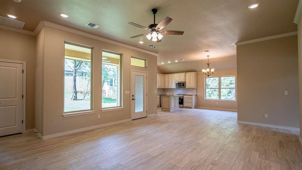 2714 Austin Drive, Granbury, TX 76048 View from living area into kitchen showing back door onto patio
