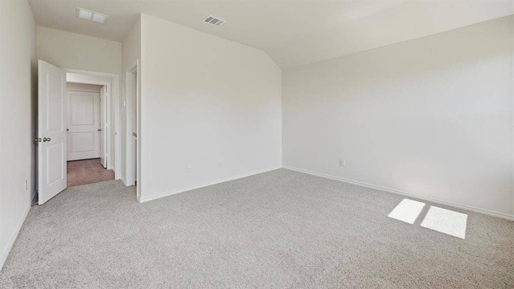 443 Epiphany Lane, Lavon, TX 75166 Spacious room featuring light gray carpeting, white walls, and white trim