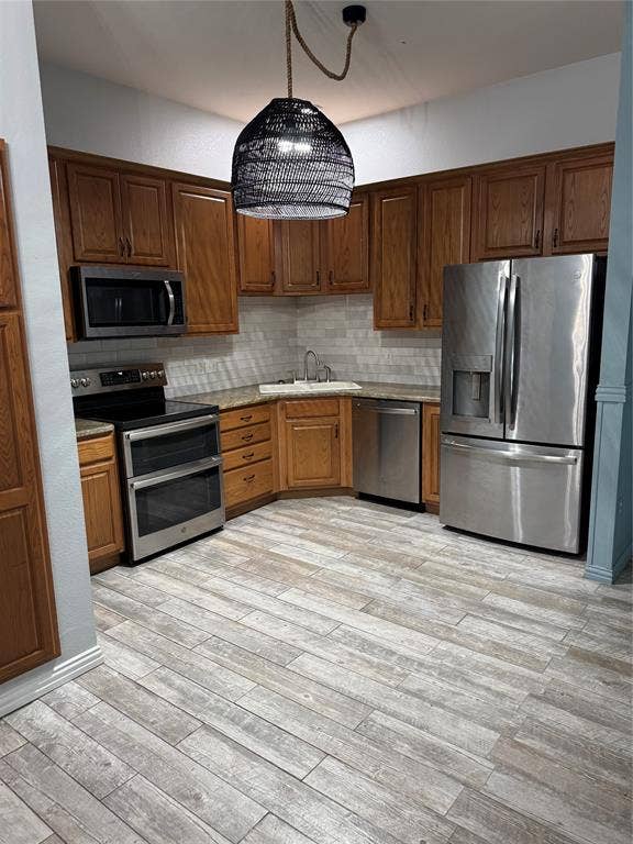 1006 Teresa Court, Granbury, TX 76048 spacious kitchen with tile floor, double oven, granite and refrigerator