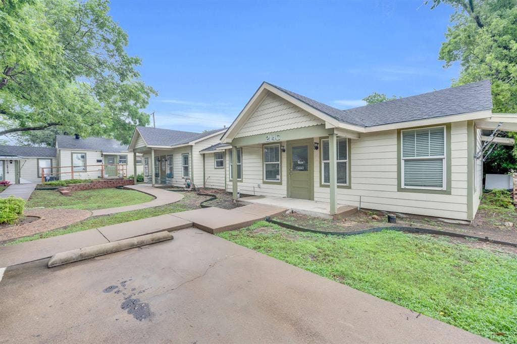 214 W Belt Line Road, #B, Cedar Hill, TX 75104 Multiple residential units with light siding and dark trim