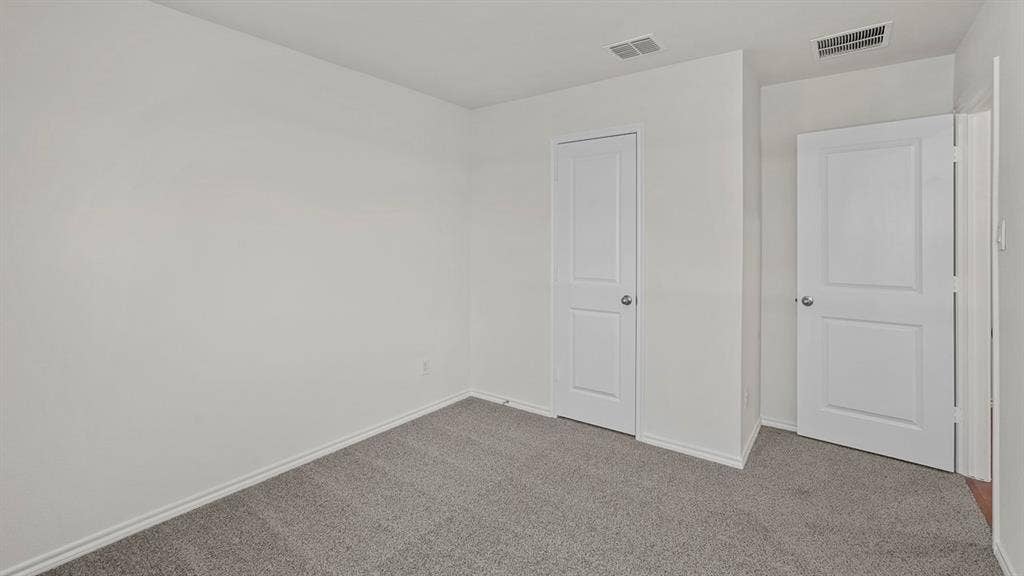809 Brook Lane, Josephine, TX 75135 Neutral wall paint, gray carpet flooring, and white interior doors