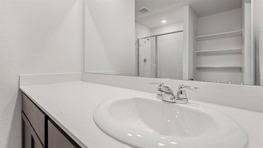 809 Brook Lane, Josephine, TX 75135 White countertop with an integrated sink and chrome faucet
