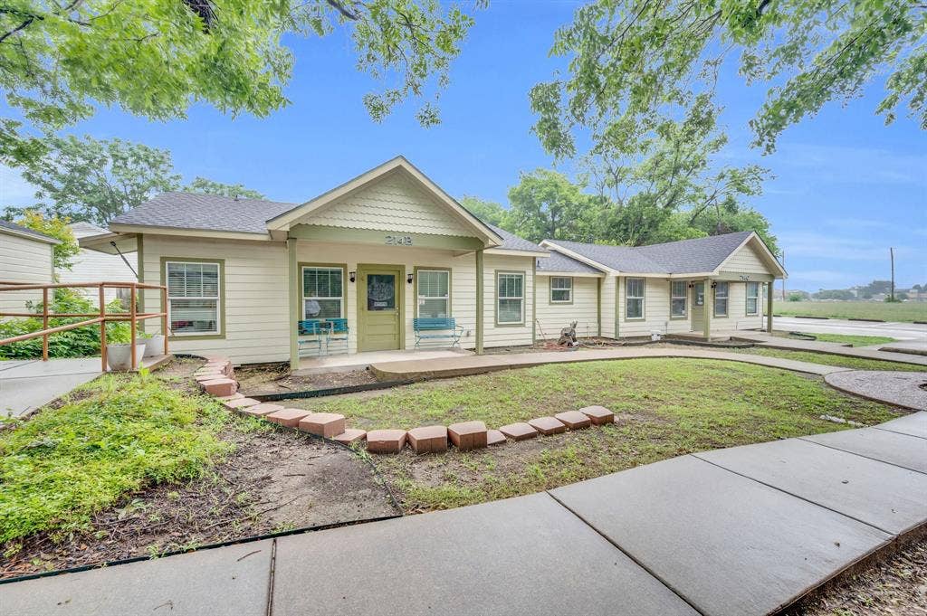 214 W Belt Line Road, #C, Cedar Hill, TX 75104 Single-story structure with light-colored siding, a dark shingle roof, and a covered porch entry