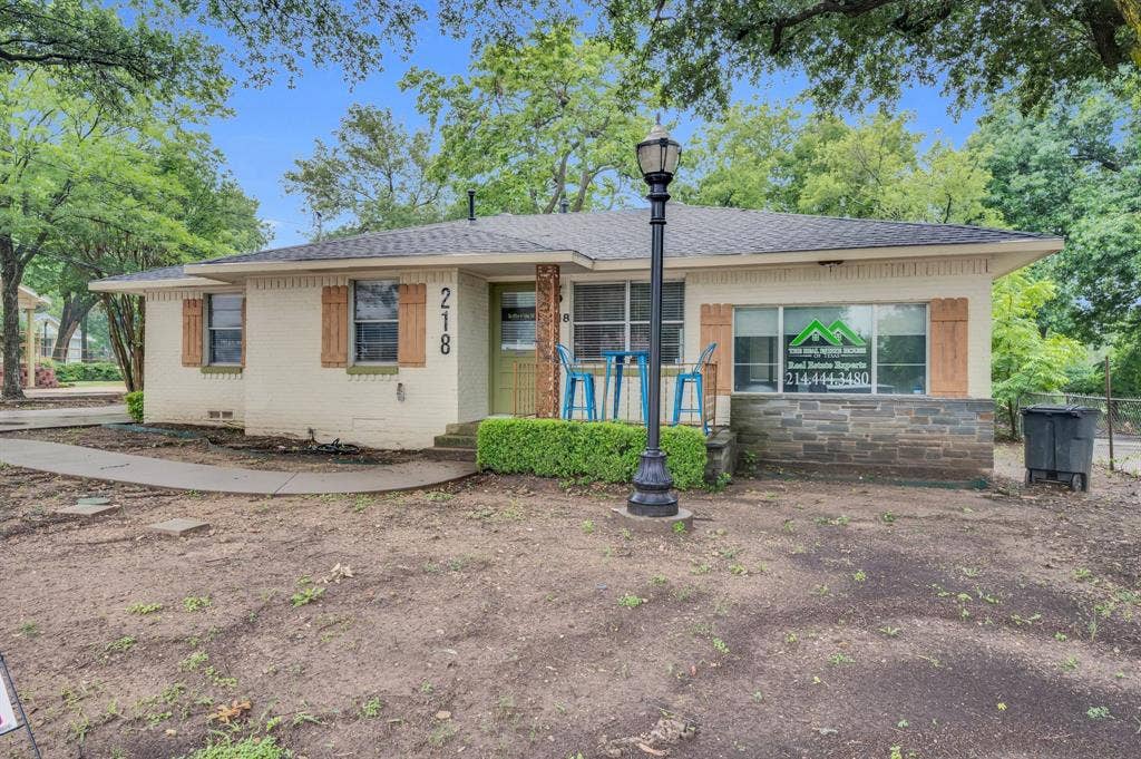 216 W Belt Line Road, Cedar Hill, TX 75104 Cream brick exterior with stone accenting, wood shutters, and a covered entry