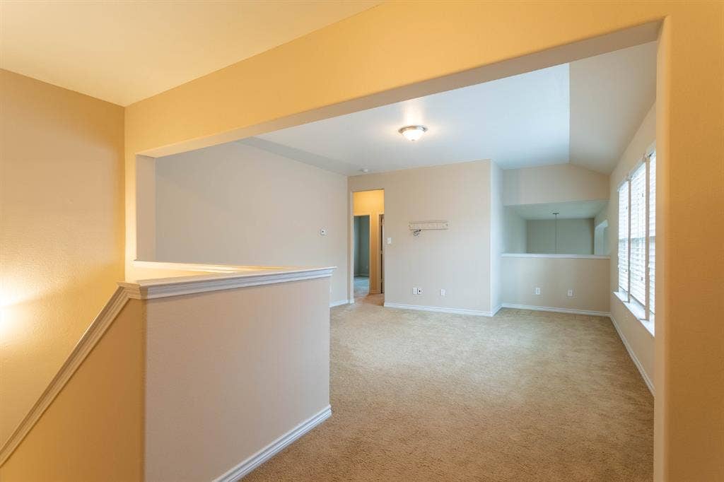 6509 Hickory Hill Drive, Plano, TX 75074 Carpeted living area with abundant natural light, multiple windows with blinds, and recessed lighting
