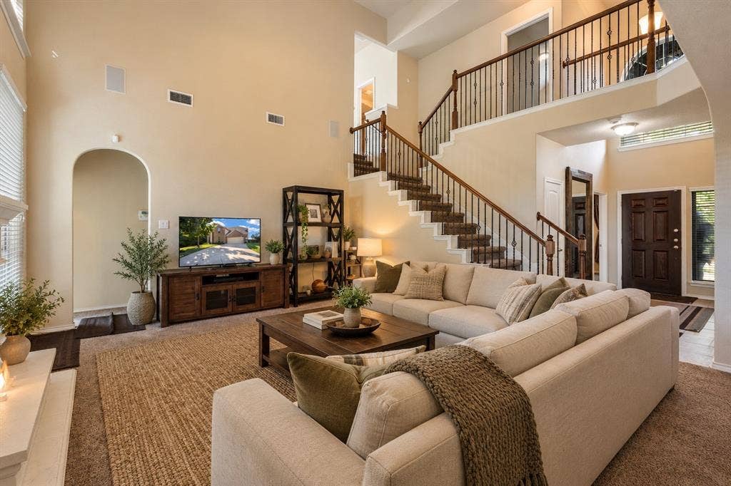 1300 Bellingham Circle, Glenn Heights, TX 75154 Virtually staged living room with a clean, bright, and inviting design that highlights the space’s open and comfortable feel.