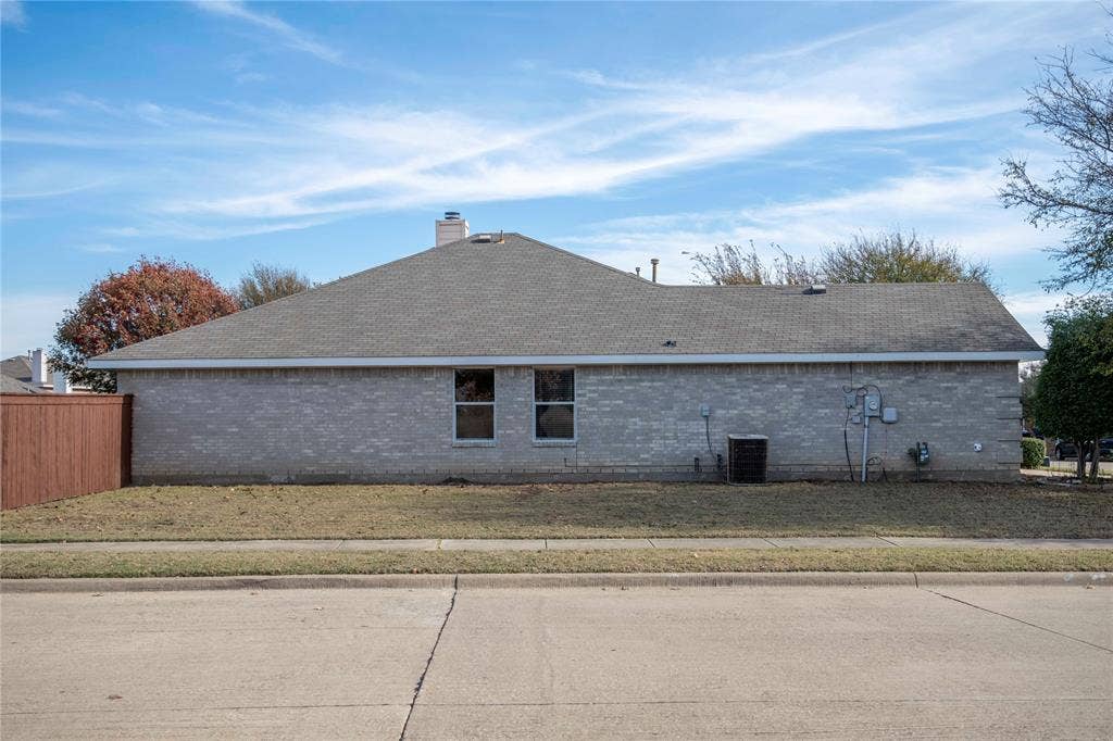 15534 Durango Drive, Frisco, TX 75035 Light-colored brick exterior with a gray shingle roof