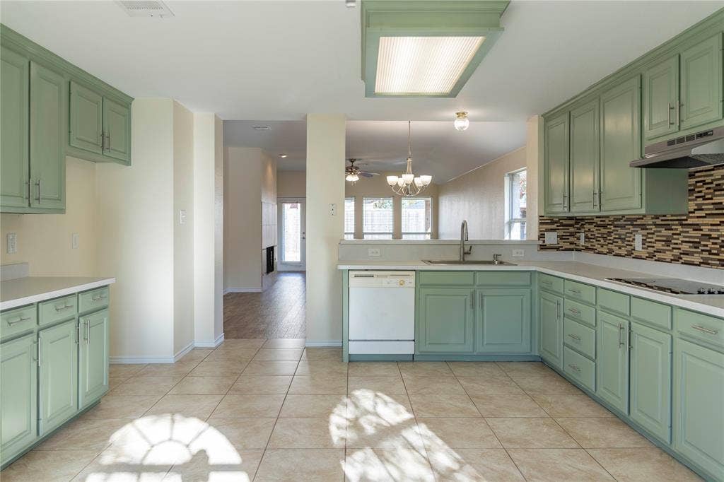 15534 Durango Drive, Frisco, TX 75035 Kitchen with tile flooring, light green cabinetry, white countertops, and a mosaic tile backsplash