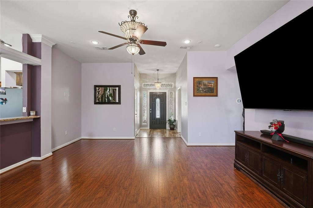 1125 Bayfield Drive, Denton, TX 76209 Spacious living area featuring wood-finish flooring, recessed lighting, and a decorative ceiling fan
