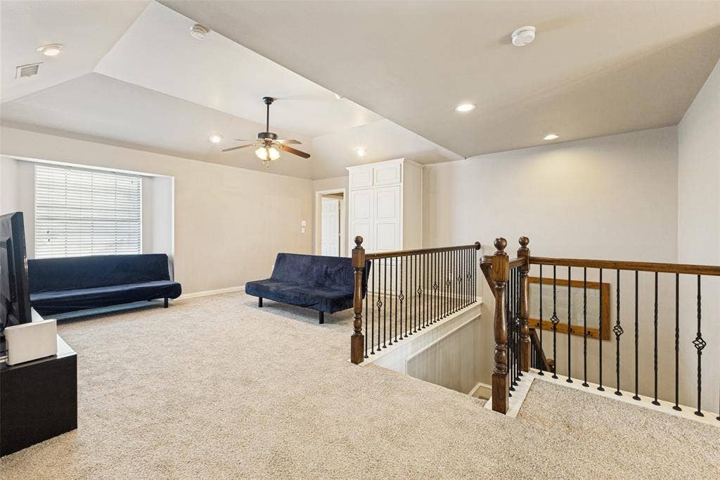 1227 Comanche Drive, Allen, TX 75013 Carpeted upper-level space featuring a vaulted ceiling with recessed lighting and a ceiling fan