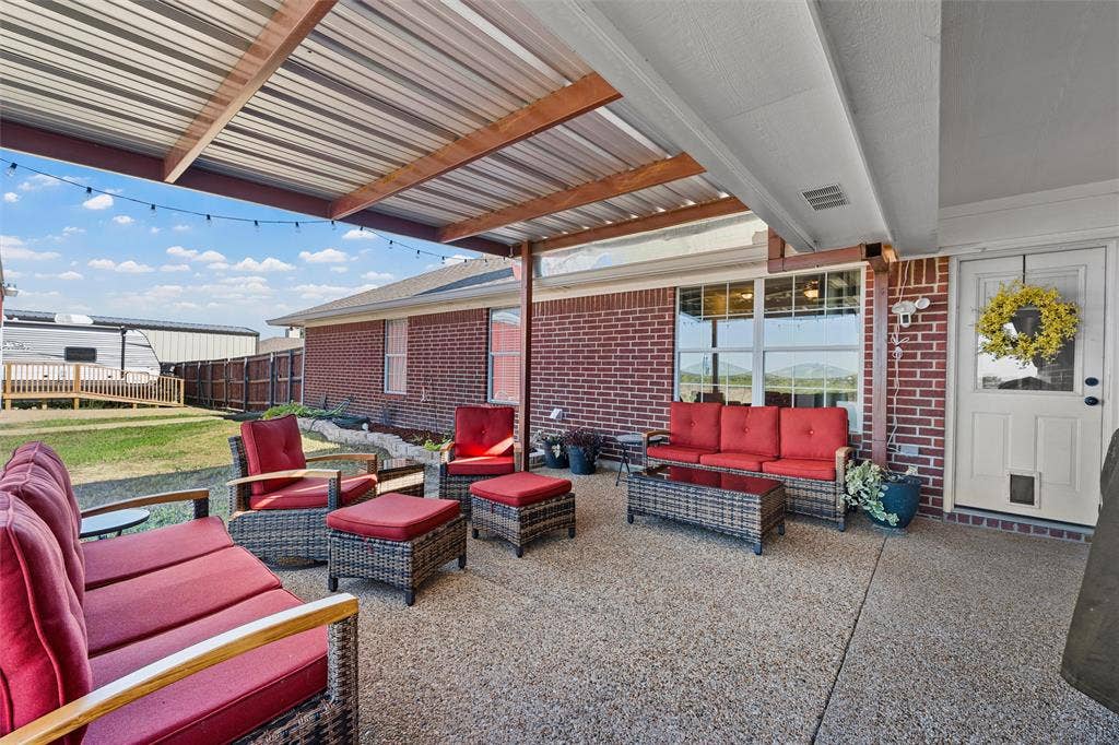 Covered patio with an exposed aggregate concrete surface