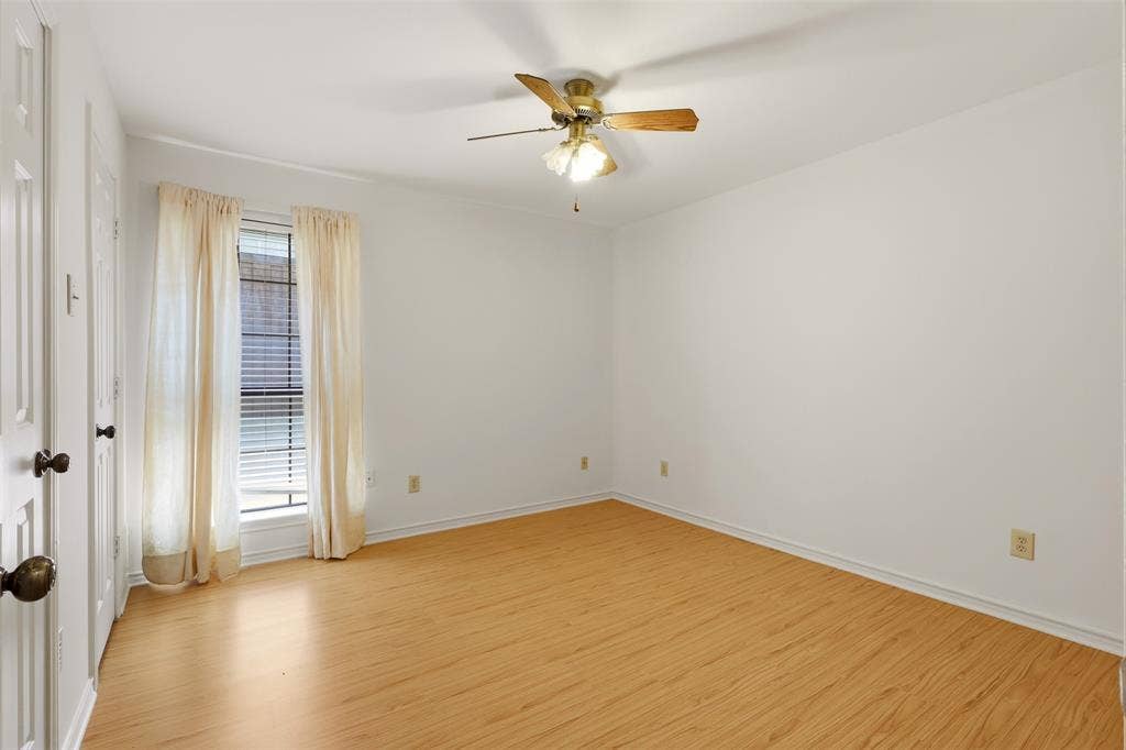 2700 Nighthawk Drive, Plano, TX 75025 Wood-finish flooring, white walls, ceiling fan, and window with blinds