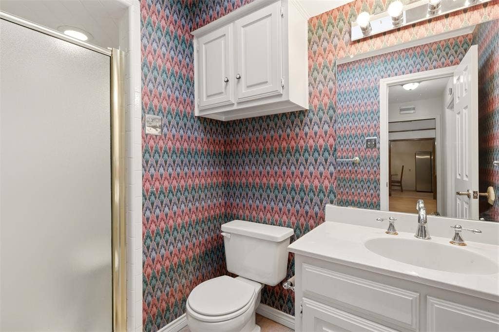2700 Nighthawk Drive, Plano, TX 75025 White vanity with an integrated sink and chrome faucet