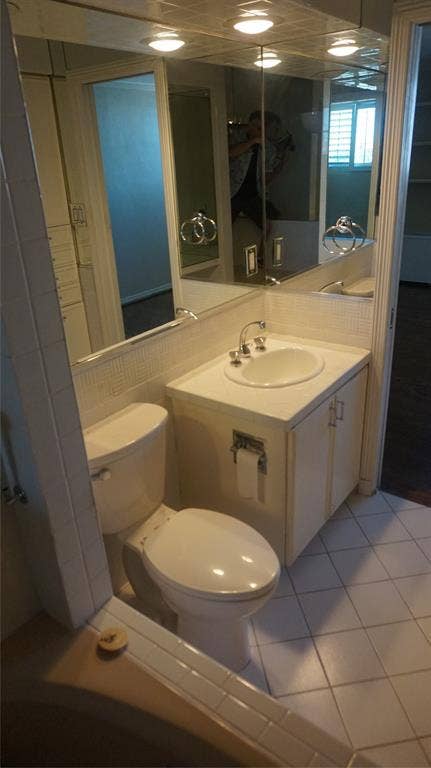 3883 Turtle Creek Boulevard, #1114, Dallas, TX 75219 Vanity with a built-in sink and storage cabinet