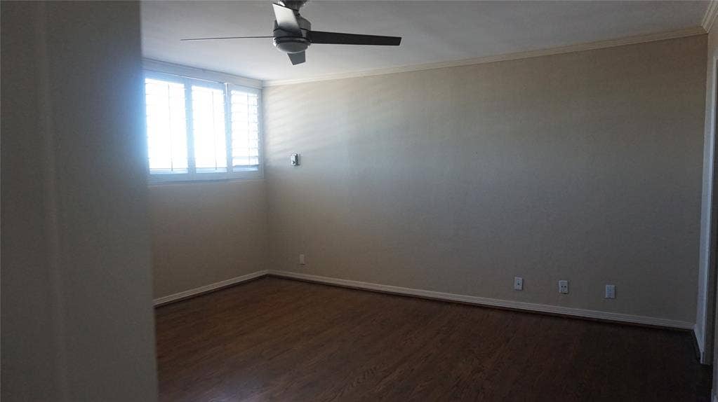 3883 Turtle Creek Boulevard, #1114, Dallas, TX 75219 Wood-finish flooring, ceiling fan, crown molding, plantation shutters, and light-toned wall finishes