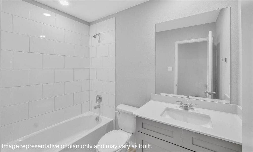 3308 Blue Jay Way, Richland Hills, TX 76118 Built-in bathtub with subway tile surround, chrome shower fixtures, vanity with integrated sink, chrome faucet, and expansive wall-mounted mirror