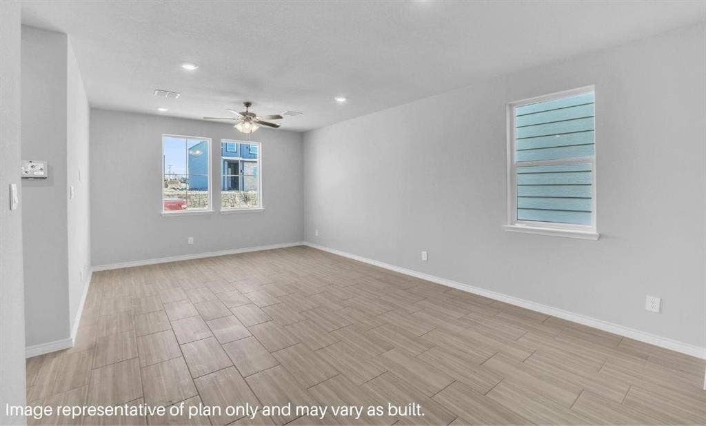 3308 Blue Jay Way, Richland Hills, TX 76118 Spacious room featuring tile flooring, multiple windows, a ceiling fan, and recessed lighting