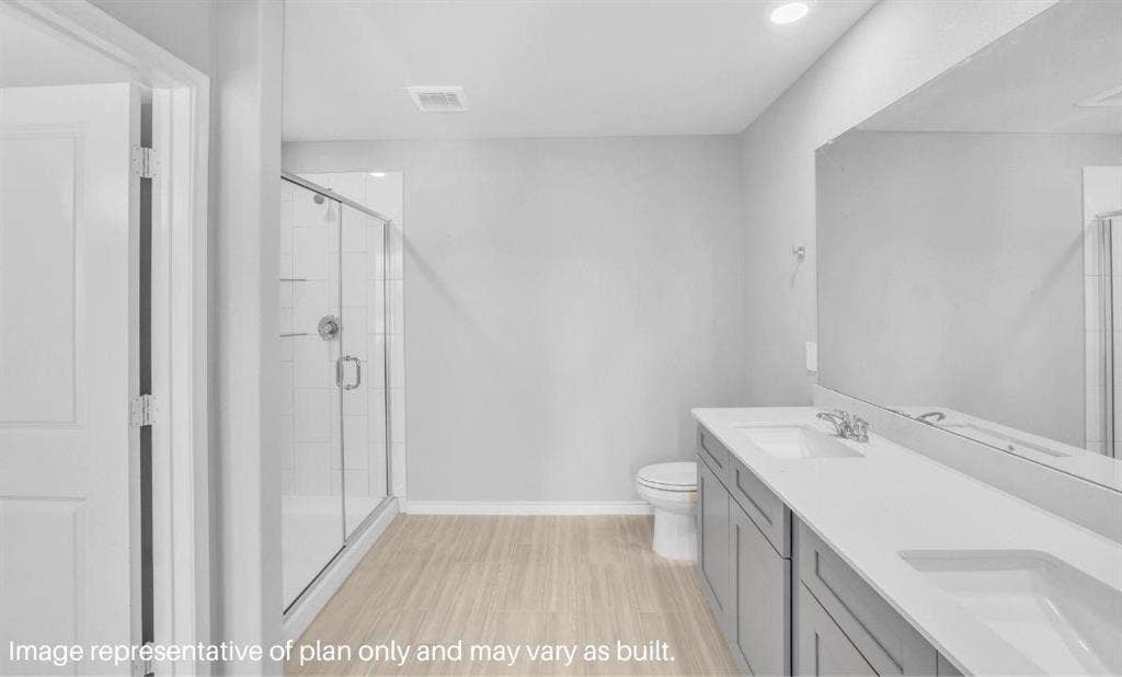3308 Blue Jay Way, Richland Hills, TX 76118 Dual vanity with integrated sinks, glass-enclosed shower, wood-finish flooring, and recessed lighting