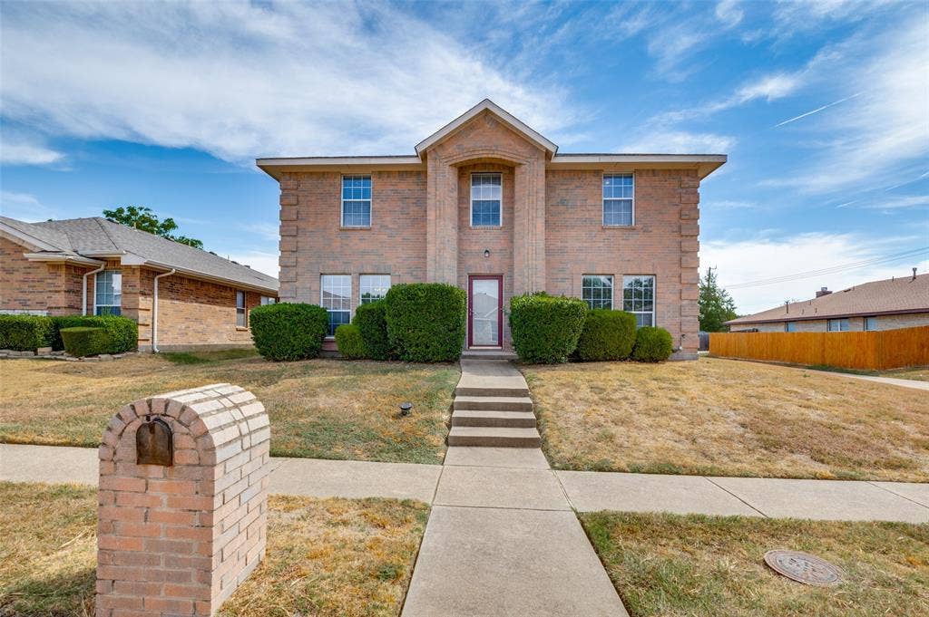 1308 Arbordale Court, Lancaster, TX 75134 Brick two-story exterior with a centered entrance
