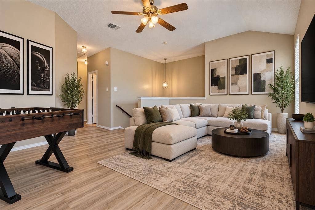 1308 Arbordale Court, Lancaster, TX 75134 Vaulted ceiling with a ceiling fan, light wood-finish flooring, and an open-concept layout