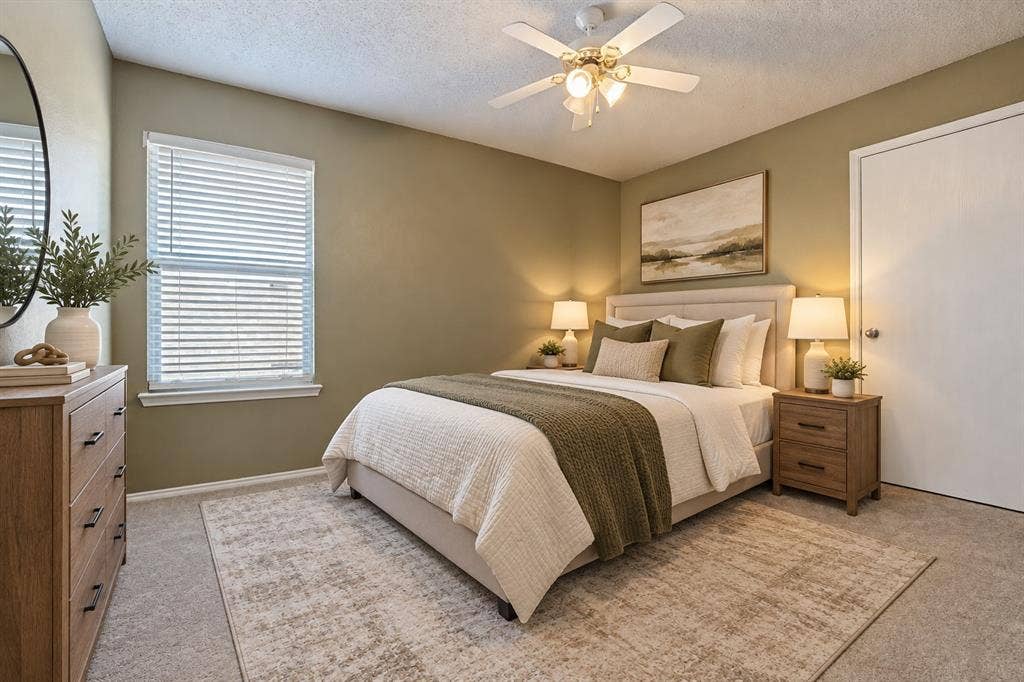 1308 Arbordale Court, Lancaster, TX 75134 Wall-to-wall carpeting, window with blinds, ceiling fan with integrated lighting, and a neutral wall color