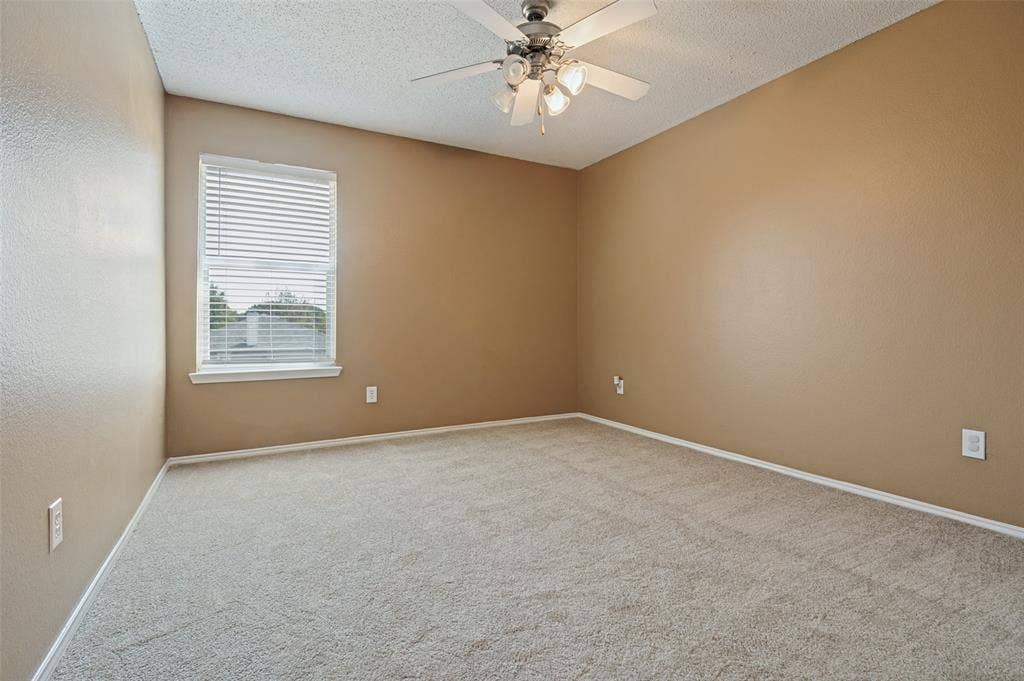 1308 Arbordale Court, Lancaster, TX 75134 Wall-to-wall carpeting and a ceiling fan with integrated lighting