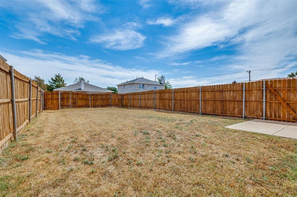 1308 Arbordale Court, Lancaster, TX 75134 Fenced backyard with a concrete patio
