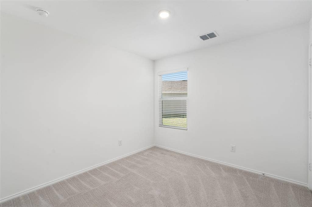 250 Herman Lane, Princeton, TX 75407 Carpeted flooring, recessed lighting, window with blinds, white walls, and a ceiling-mounted ventilation register