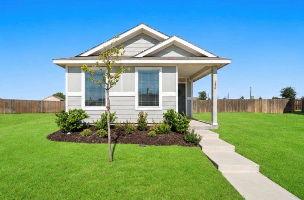 250 Herman Lane, Princeton, TX 75407 Single-story residence featuring light gray siding and a covered front porch