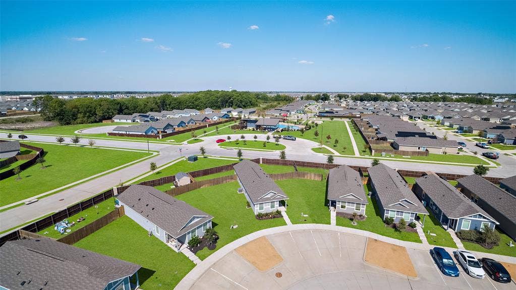 250 Herman Lane, Princeton, TX 75407 Residential neighborhood featuring single-story homes, paved streets, and green lawns