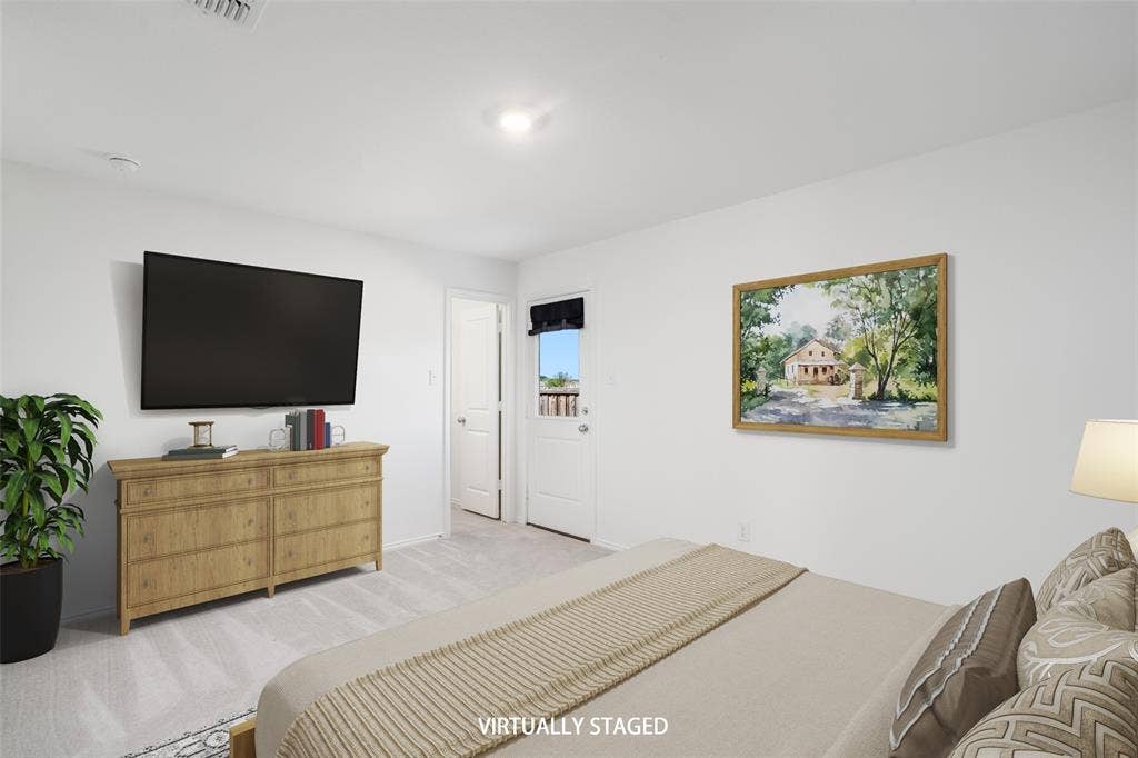 250 Herman Lane, Princeton, TX 75407 Light-toned carpeted flooring, white walls, recessed ceiling lighting, and a white door with dark hardware