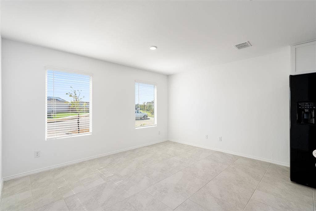 250 Herman Lane, Princeton, TX 75407 Recessed lighting, tile flooring, and two windows with blinds