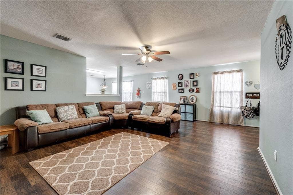 12829 Pricklybranch Drive, Fort Worth, TX 76244 Wood-finish flooring throughout the living space