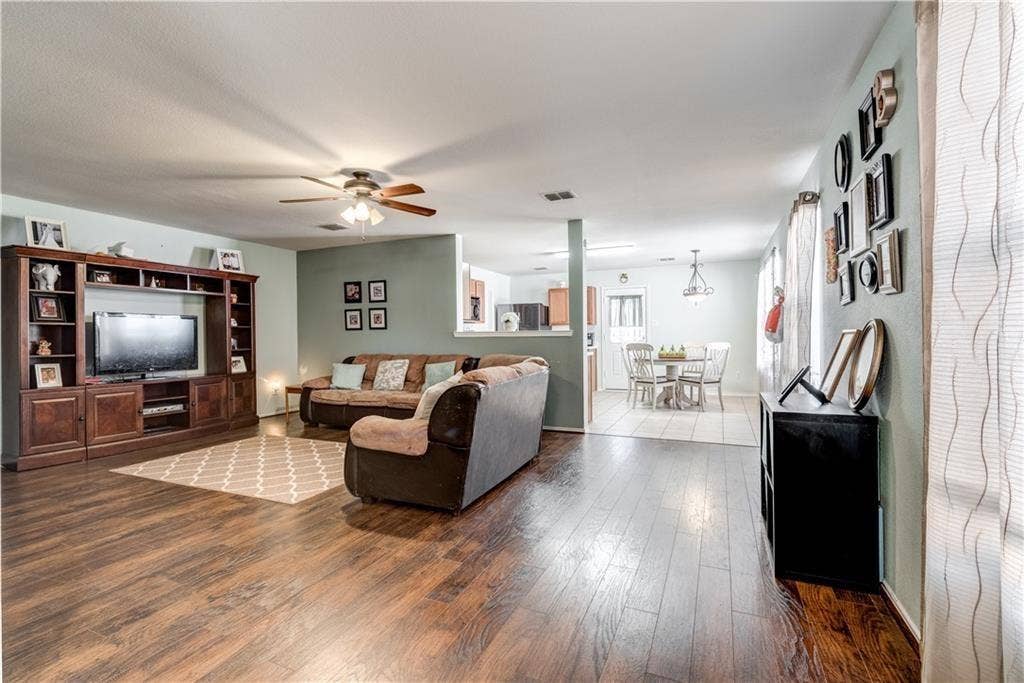 12829 Pricklybranch Drive, Fort Worth, TX 76244 Wood-finish flooring, built-in entertainment center, ceiling fan, recessed lighting, and light-toned wall color
