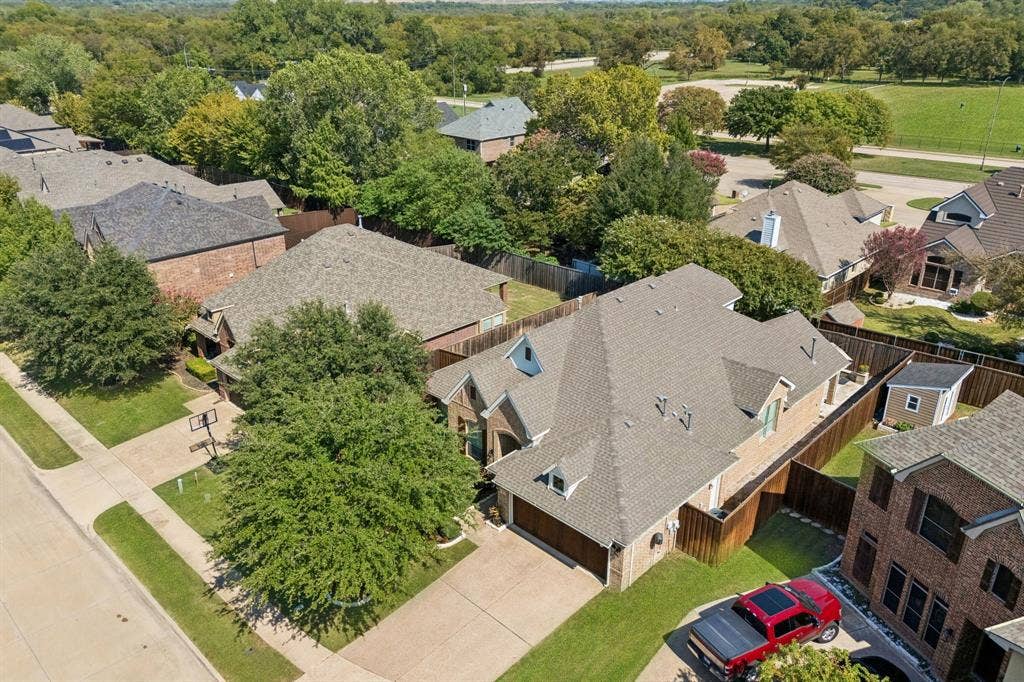 2403 Laguna Lane, Arlington, TX 76012 Another aerial view showing the attached garage and wood privacy fence