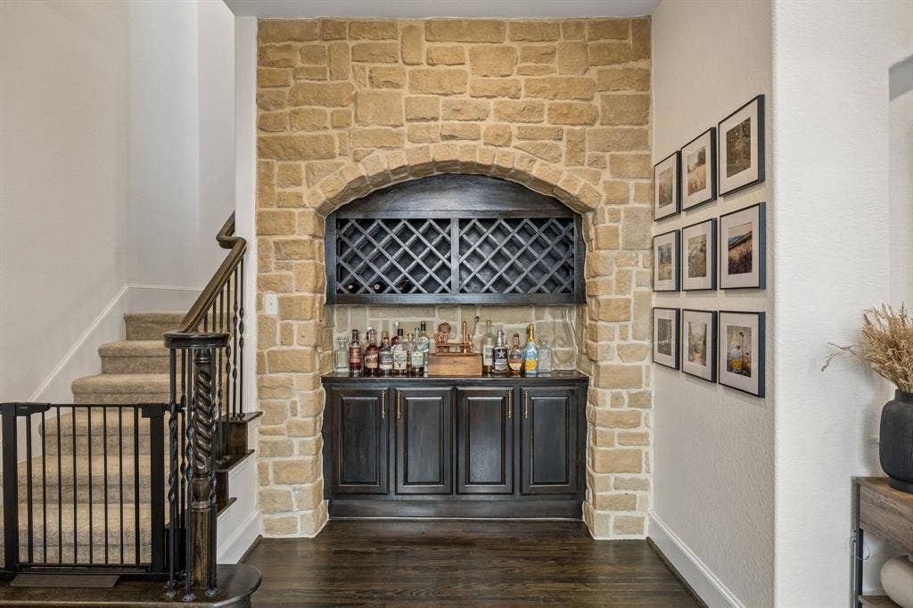 2403 Laguna Lane, Arlington, TX 76012 Built-in stone archway with a bar including wine storage