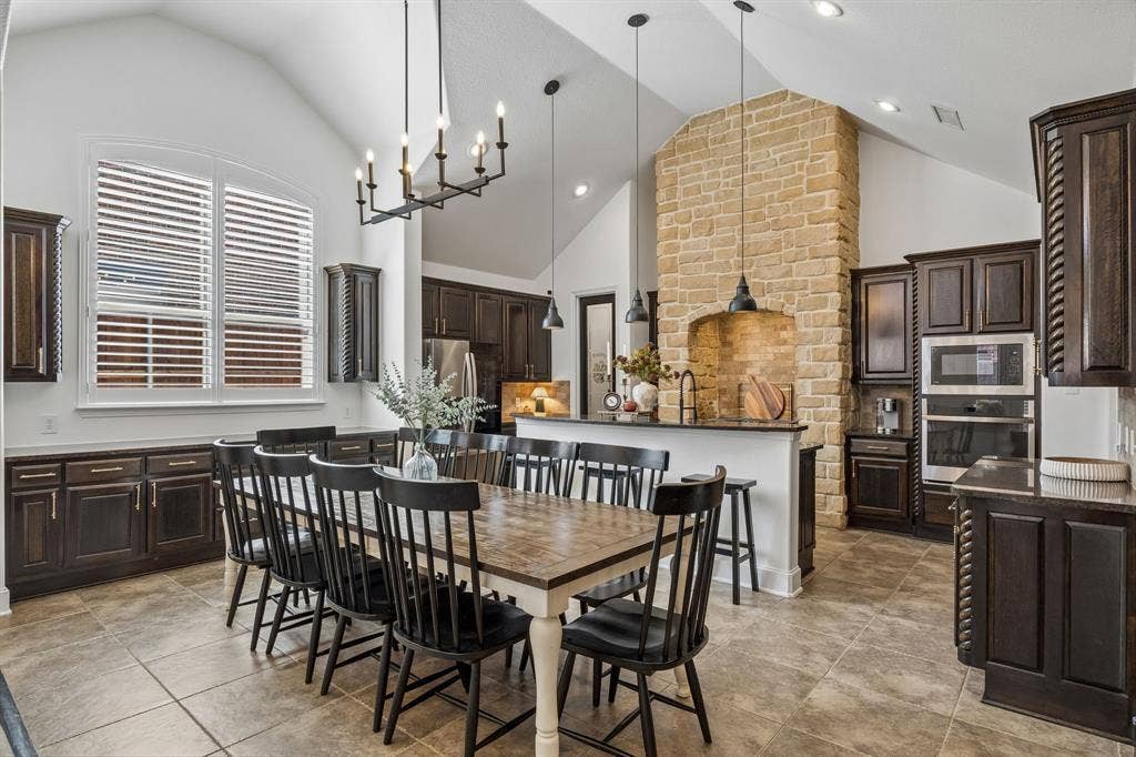 2403 Laguna Lane, Arlington, TX 76012 The dining area and kitchen feature vaulted ceilings, abundant cabinetry and modern lighting