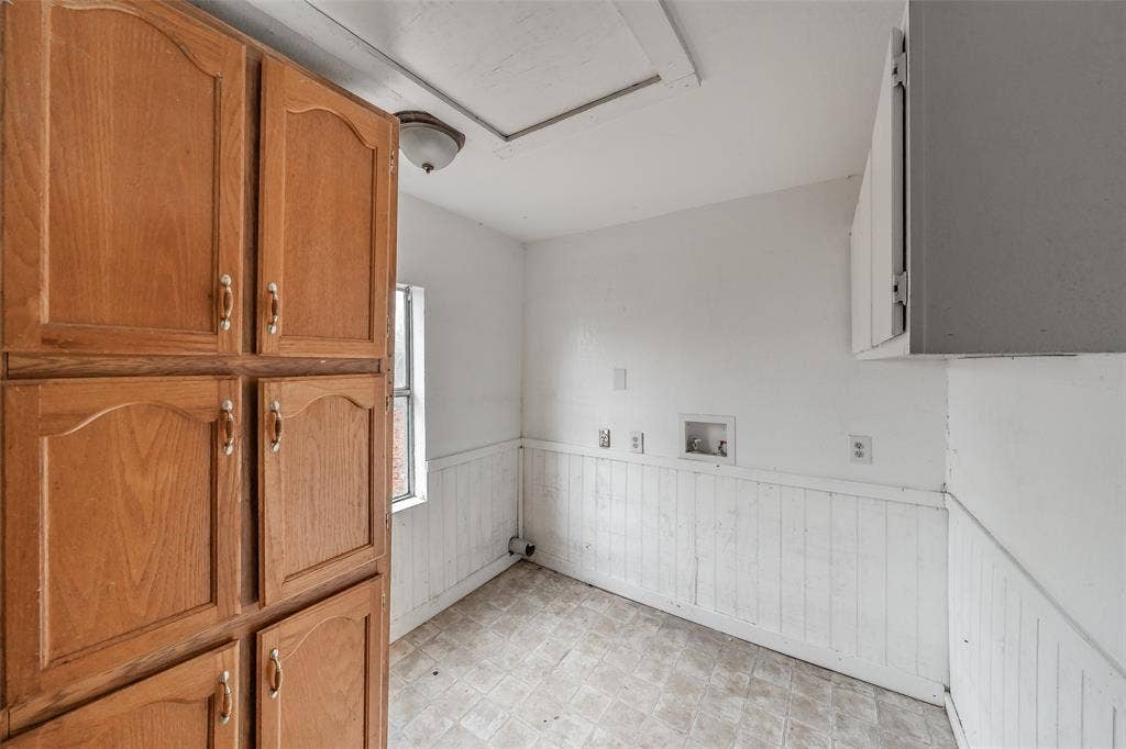 212 N Ruddell Street, Denton, TX 76205 Wood-finish cabinetry, built-in storage, and a utility sink hookup