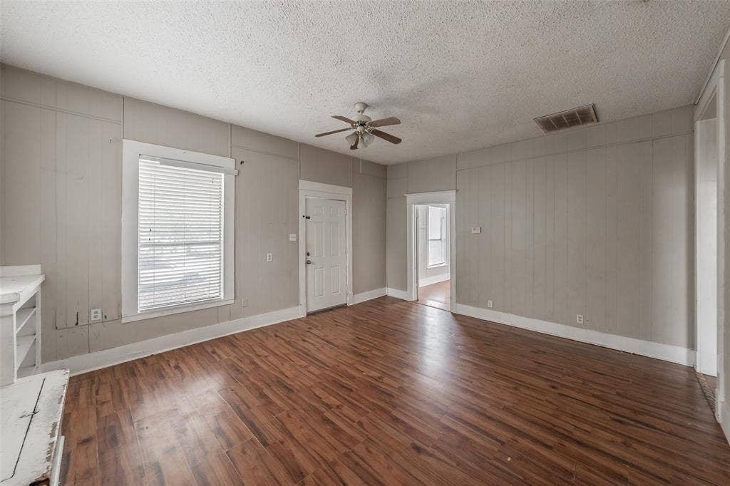 212 N Ruddell Street, Denton, TX 76205 Wood-finish flooring throughout, ceiling fan, and white trim