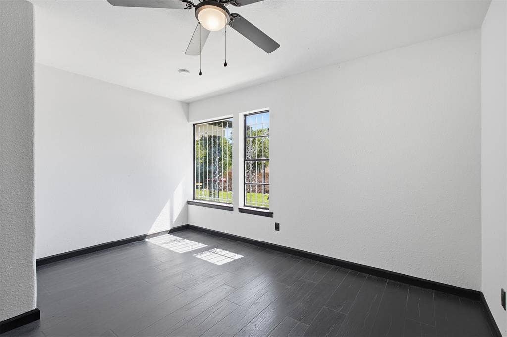 2313 Clearview Drive, Fort Worth, TX 76119 Dark wood-finish flooring with crisp white walls